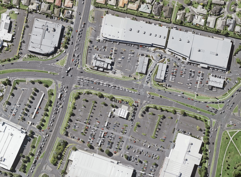 Aerial view of Botany, Auckland, a place with most of its land devoted to storing or moving cars